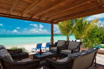 Covered deck on the beach at Villa Mirabelle